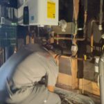 Technician working on tankless water heater
