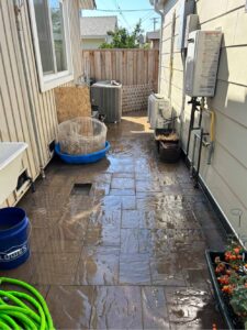 Outdoor Patio in San Jose showing wall mounted tankless water heater