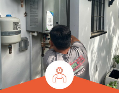 Tankless Guys Plumbers inspecting an outside water heater.